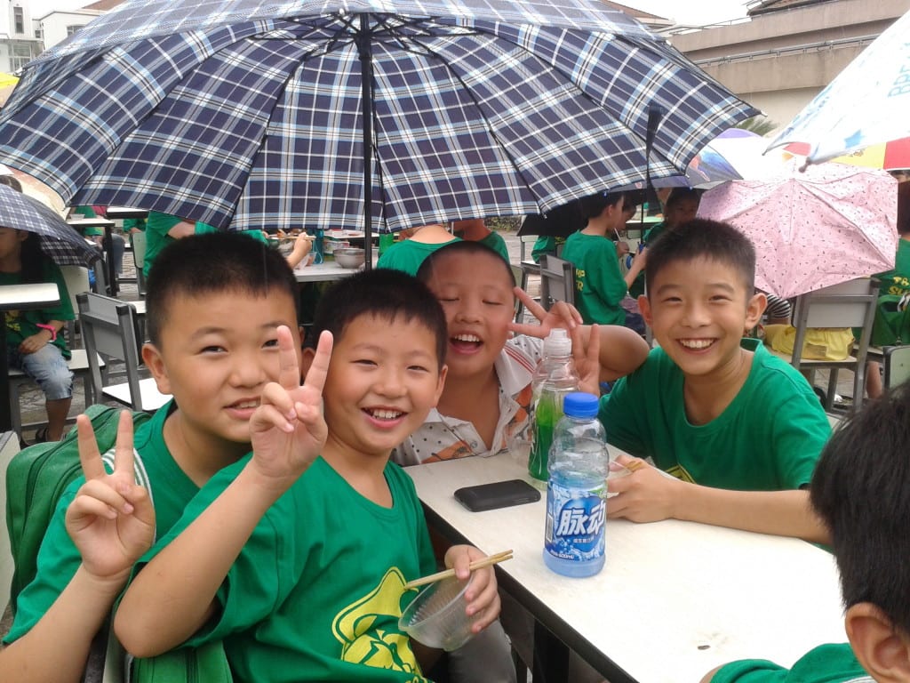 School students in teach English in China summer camp happy